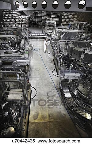 Worker and machinery in a brewery View Large Photo Image Stock Photography - Worker and machinery in a brewery. Fotosearch