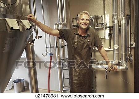 Worker at brewery taking a break View Large Photo Image Stock Image - Worker at brewery taking a break. Fotosearch