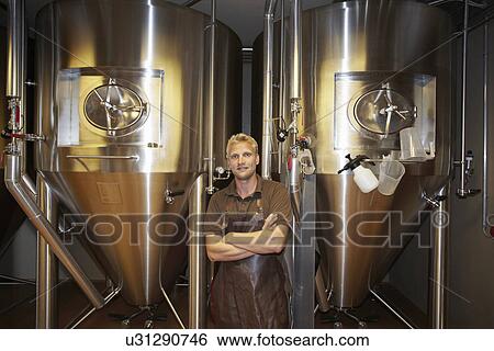 Worker at brewery taking a break View Large Photo Image Stock Photograph - Worker at brewery taking a break. Fotosearch