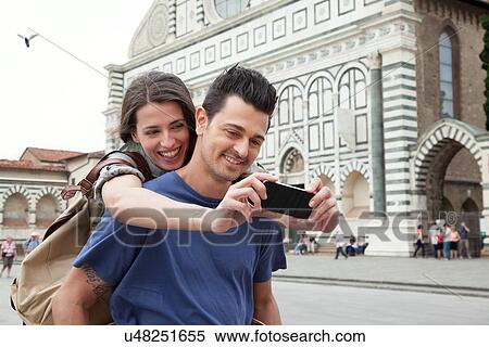 Young couple outside Santa Maria Novella church, Florence, Tuscany, Italy View Large Photo Image Stock Photography - Young couple outside Santa Maria Novella church, Florence, Tuscany, Italy. Fotosearch