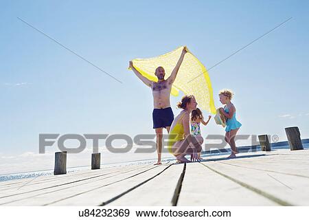 Young family on pier, Utvalnas, Gavle, Sweden View Large Photo Image Stock Photo - Young family on pier, Utvalnas, Gavle, Sweden. Fotosearch