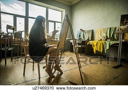 Young female painting canvas in artist studio View Large Photo Image Stock Image - Young female painting canvas in artist studio. Fotosearch