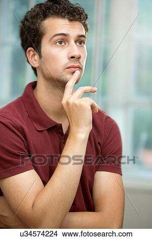 Young man daydreaming View Large Photo Image Picture - Young man daydreaming. Fotosearch