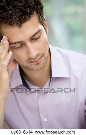 Young man in deep thoughts View Large Photo Image Picture - Young man in deep thoughts. Fotosearch
