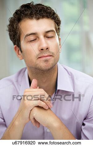 Young man in deep thoughts View Large Photo Image Stock Image - Young man in deep thoughts. Fotosearch