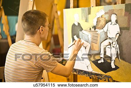 Stock Photography - Young man painting picture. Fotosearch