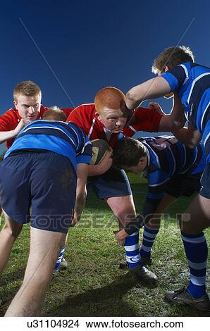Picture - Young men playing rugby. Fotosearch