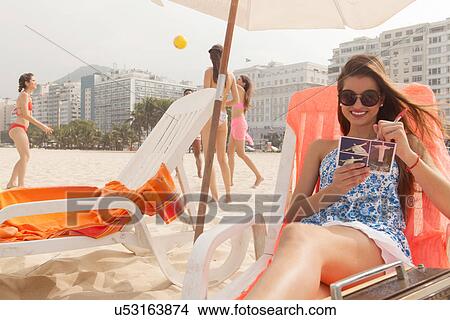 Picture - Young people playing and relaxing on Copacabana beach, Rio de Janeiro, Brazil. Fotosearch