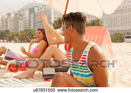 Young people relaxing on Copacabana Beach, Rio de Janeiro, Brazil View Large Photo Image Stock Image - Young people relaxing on Copacabana Beach, Rio de Janeiro, Brazil. Fotosearch