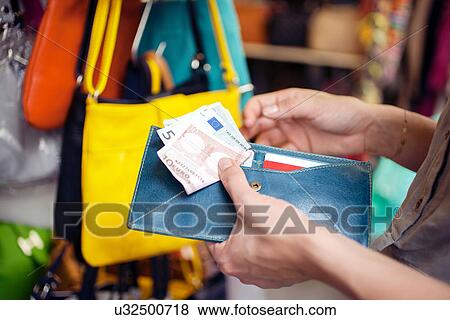 Young woman buying handbag, San Lorenzo market, Florence, Tuscany, Italy View Large Photo Image Stock Photo - Young woman buying handbag, San Lorenzo market, Florence, Tuscany, Italy. Fotosearch
