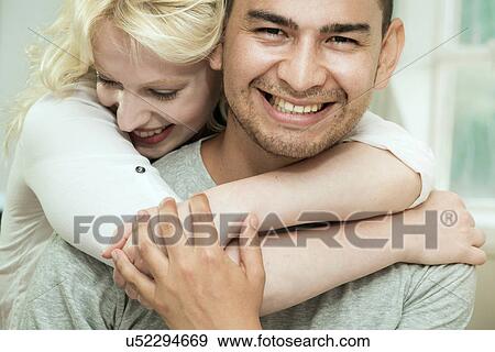 Young woman hugging boyfriend View Large Photo Image Stock Photo - Young woman hugging boyfriend. Fotosearch