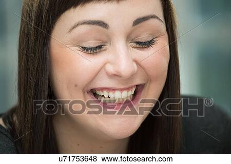 Young woman laughing, eyes closed View Large Photo Image Stock Photo - Young woman laughing, eyes closed. Fotosearch