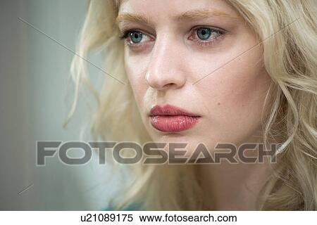 Stock Photography - Young woman looking sad. Fotosearch