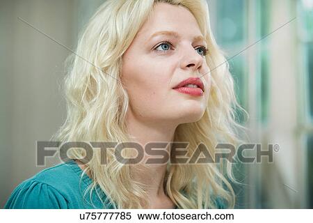 Young woman looking up View Large Photo Image Stock Photography - Young woman looking up. Fotosearch