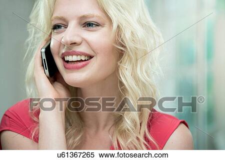 Young woman on cellphone, smiling View Large Photo Image Stock Photography - Young woman on cellphone, smiling. Fotosearch