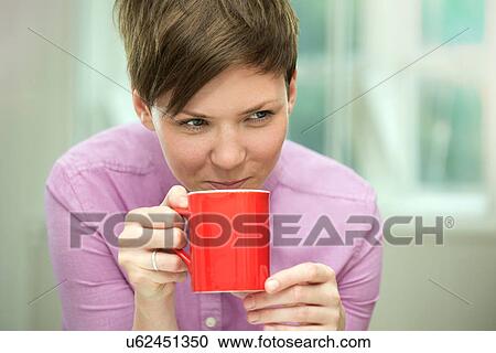 Young woman taking coffee break View Large Photo Image Stock Image - Young woman taking coffee break. Fotosearch