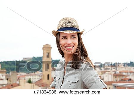 Young woman wearing straw hat, Florence, Tuscany, Italy View Large Photo Image Stock Photograph - Young woman wearing straw hat, Florence, Tuscany, Italy. Fotosearch