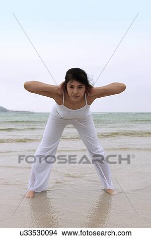 Beach, Exercising, Yoga, Body Care, Body Conscious, Fitness, Asian Ethnicity View Large Photo Image Picture - Beach, Exercising, Yoga, Body Care, Body Conscious, Fitness, Asian Ethnicity. Fotosearch