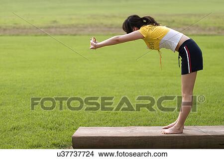Picture - Beach, Exercising, Yoga, Body Care, Body Conscious, Fitness, Asian Ethnicity. Fotosearch