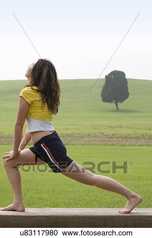Stock Image - Beach, Exercising, Yoga, Body Care, Body Conscious, Fitness, Asian Ethnicity. Fotosearch