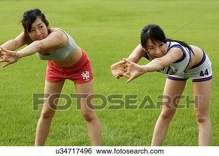 Stock Photograph - Beach, Exercising, Yoga, Body Care, Body Conscious, Fitness, Asian Ethnicity. Fotosearch