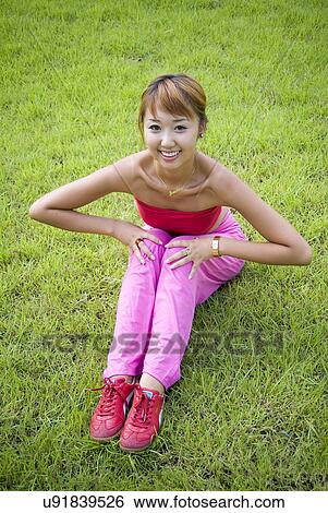 Stock Photograph - Beach, Exercising, Yoga, Body Care, Body Conscious, Fitness, Asian Ethnicity. Fotosearch