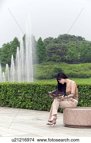 Picture - Greenery, Young Couple, Lying Down, Leisure Activity, Young Adult, Asian Ethnicity. Fotosearch