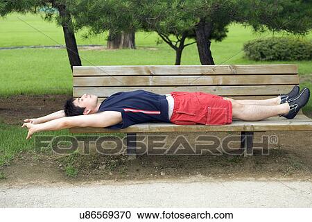 Greenery, Young Couple, Lying Down, Leisure Activity, Young Adult, Asian Ethnicity View Large Photo Image Stock Image - Greenery, Young Couple, Lying Down, Leisure Activity, Young Adult, Asian Ethnicity. Fotosearch