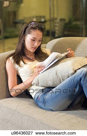 Stock Photo - Greenery, Young Couple, Lying Down, Leisure Activity, Young Adult, Asian Ethnicity. Fotosearch
