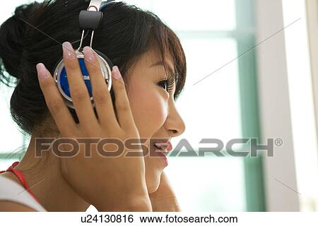 Stock Photograph - Greenery, Young Couple, Lying Down, Leisure Activity, Young Adult, Asian Ethnicity. Fotosearch