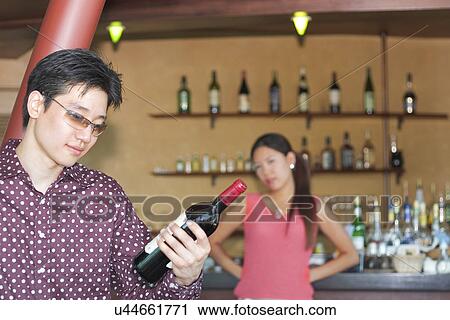 Stock Image - Happiness, Young Men, Young Adult, Young Couple, Young Women, Togetherness, Asian Ethnicity. Fotosearch