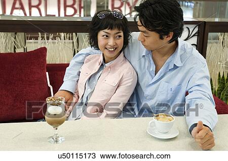 Stock Image - Happiness, Young Men, Young Adult, Young Couple, Young Women, Togetherness, Asian Ethnicity. Fotosearch