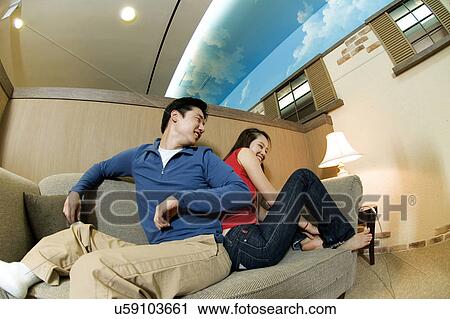 Stock Image - Happiness, Young Men, Young Adult, Young Couple, Young Women, Togetherness, Asian Ethnicity. Fotosearch