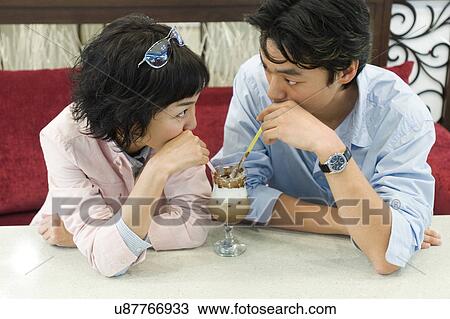 Stock Image - Happiness, Young Men, Young Adult, Young Couple, Young Women, Togetherness, Asian Ethnicity. Fotosearch
