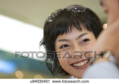Stock Image - Happiness, Young Men, Young Adult, Young Couple, Young Women, Togetherness, Asian Ethnicity. Fotosearch