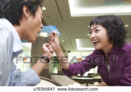 Stock Photo - Happiness, Young Men, Young Adult, Young Couple, Young Women, Togetherness, Asian Ethnicity. Fotosearch