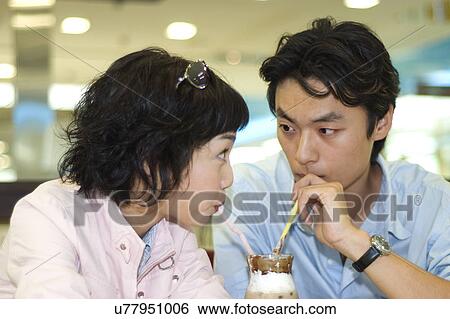 Stock Photograph - Happiness, Young Men, Young Adult, Young Couple, Young Women, Togetherness, Asian Ethnicity. Fotosearch