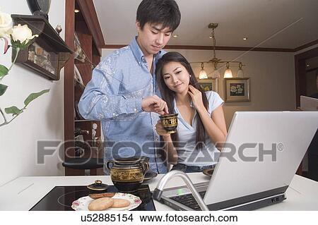 Picture - Indoors, Young Adult, Young Men, Young Women, Young Couple, Togetherness, Bonding. Fotosearch