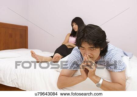 Indoors, Young Adult, Young Men, Young Women, Young Couple, Togetherness, Bonding View Large Photo Image Picture - Indoors, Young Adult, Young Men, Young Women, Young Couple, Togetherness, Bonding. Fotosearch