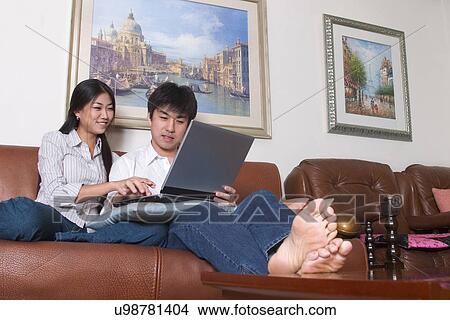 Picture - Indoors, Young Adult, Young Men, Young Women, Young Couple, Togetherness, Bonding. Fotosearch