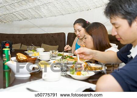Stock Image - Indoors, Young Adult, Young Men, Young Women, Young Couple, Togetherness. Fotosearch