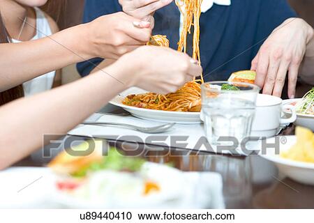 Indoors, Young Adult, Young Men, Young Women, Young Couple, Togetherness View Large Photo Image Stock Image - Indoors, Young Adult, Young Men, Young Women, Young Couple, Togetherness. Fotosearch