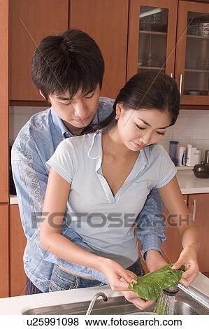 Indoors, Young Adult, Young Men, Young Women, Young Couple, Togetherness, Bonding View Large Photo Image Stock Photo - Indoors, Young Adult, Young Men, Young Women, Young Couple, Togetherness, Bonding. Fotosearch