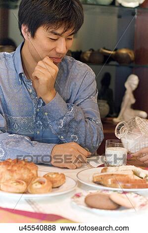 Stock Photo - Indoors, Young Adult, Young Men, Young Women, Young Couple, Togetherness. Fotosearch