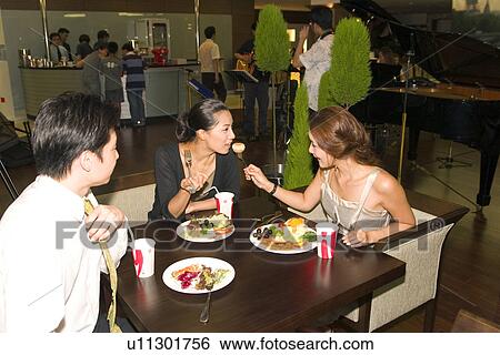 Indoors, Young Adult, Young Men, Young Women, Young Couple, Togetherness View Large Photo Image Stock Photograph - Indoors, Young Adult, Young Men, Young Women, Young Couple, Togetherness. Fotosearch