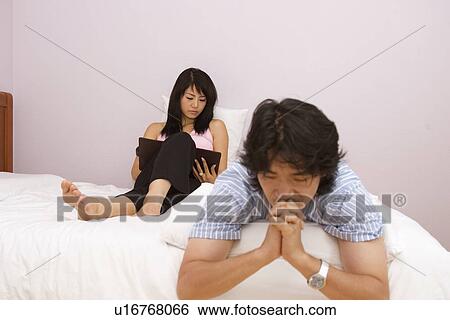 Indoors, Young Adult, Young Men, Young Women, Young Couple, Togetherness, Bonding View Large Photo Image Stock Photograph - Indoors, Young Adult, Young Men, Young Women, Young Couple, Togetherness, Bonding. Fotosearch