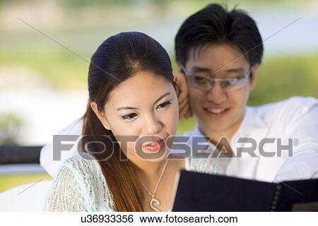 Indoors, Young Adult, Young Men, Young Women, Young Couple, Togetherness View Large Photo Image Stock Photograph - Indoors, Young Adult, Young Men, Young Women, Young Couple, Togetherness. Fotosearch