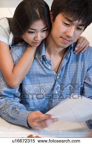 Indoors, Young Adult, Young Men, Young Women, Young Couple, Togetherness, Bonding View Large Photo Image Stock Photography - Indoors, Young Adult, Young Men, Young Women, Young Couple, Togetherness, Bonding. Fotosearch