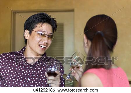 Indoors, Young Adult, Young Men, Young Women, Young Couple, Togetherness View Large Photo Image Stock Photography - Indoors, Young Adult, Young Men, Young Women, Young Couple, Togetherness. Fotosearch