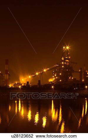 Stock Image - Outdoors, Day, Dusk, Engineering, Industrial, Crane, Sky. Fotosearch